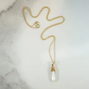 Glossy Baroque Pearl Pendant Crowned in Gold